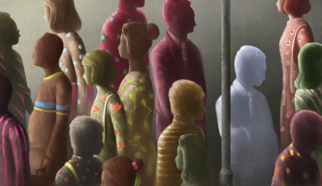 Sad and lonely man in crowd