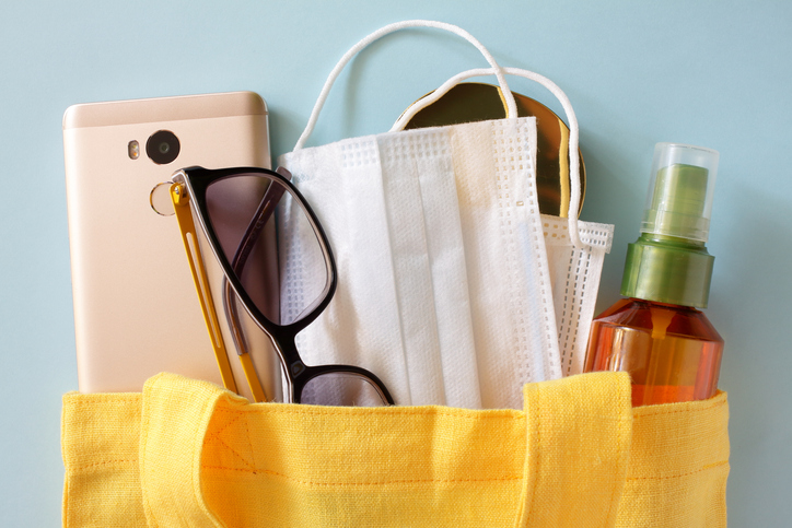 Coronavirus Pandemic CoVID-19 concept. Women's modern accessories in a linen tote bag.