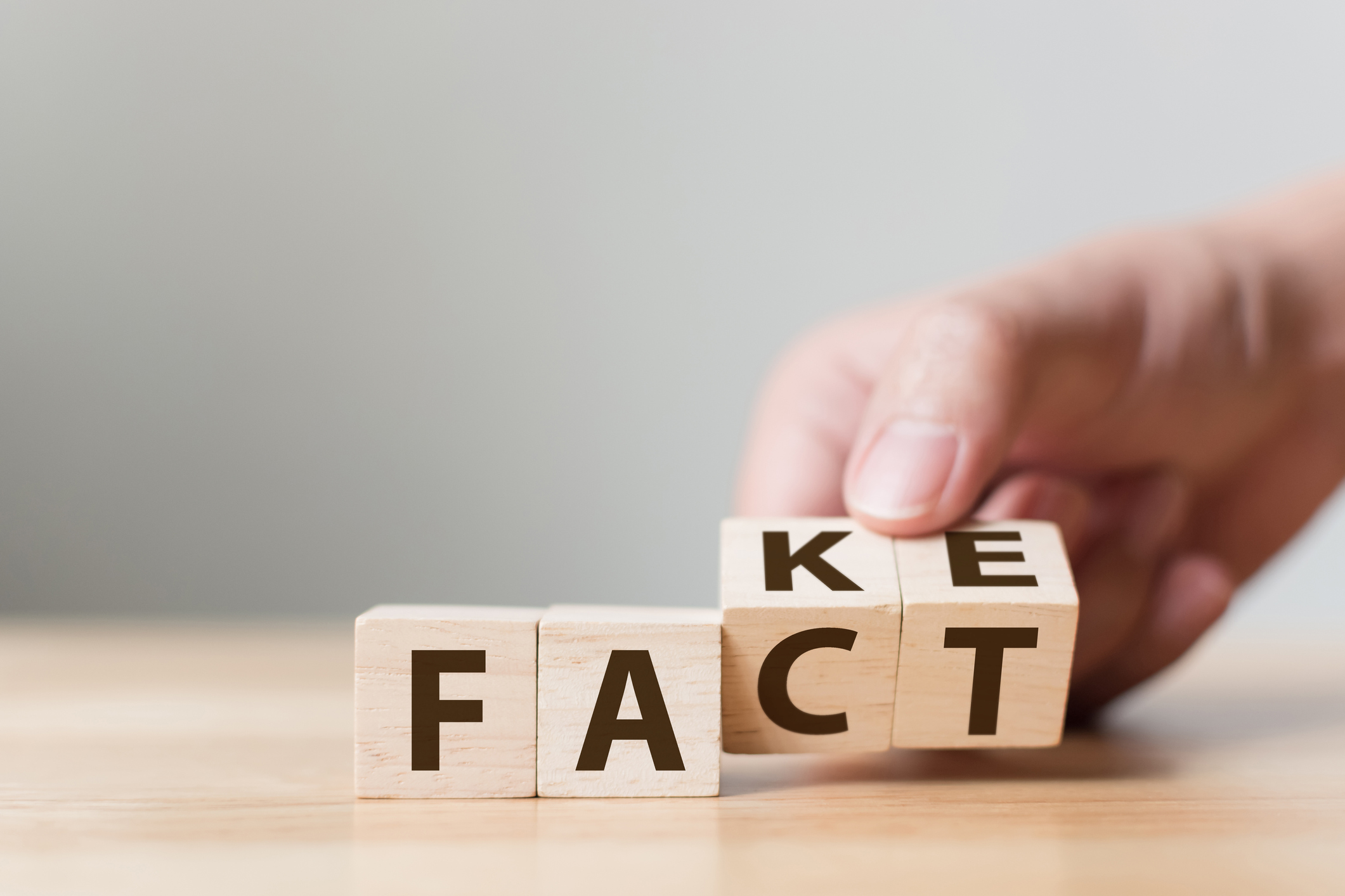 Fact or Fake concept, Hand flip wood cube change the word, April fools day bulos