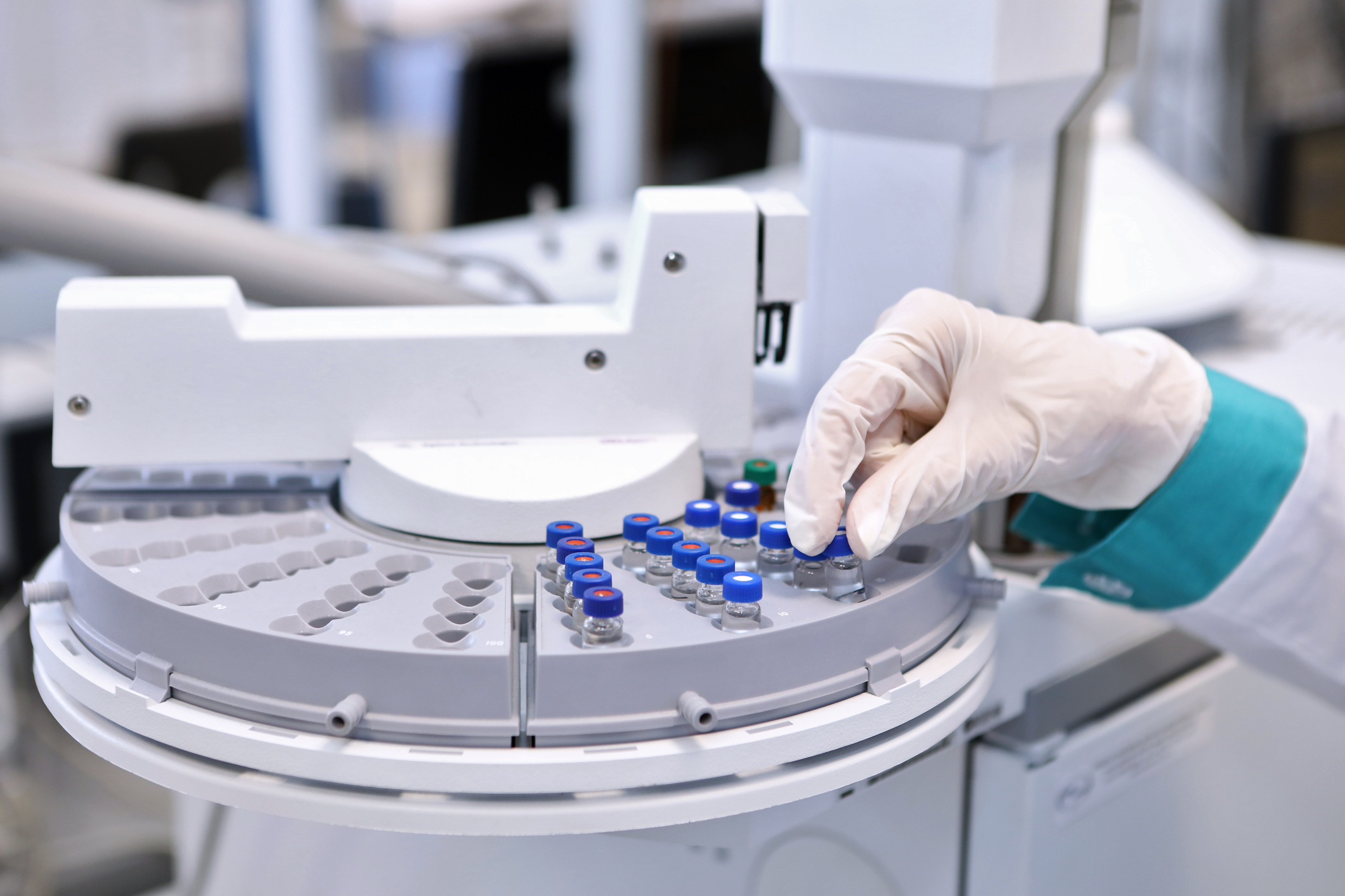 Quality Control Laboratory medicine. Chromatograph operation. A woman makes an analysis on a gas chromatograph. Development of a new vaccine against the covid-19 virus vacunas